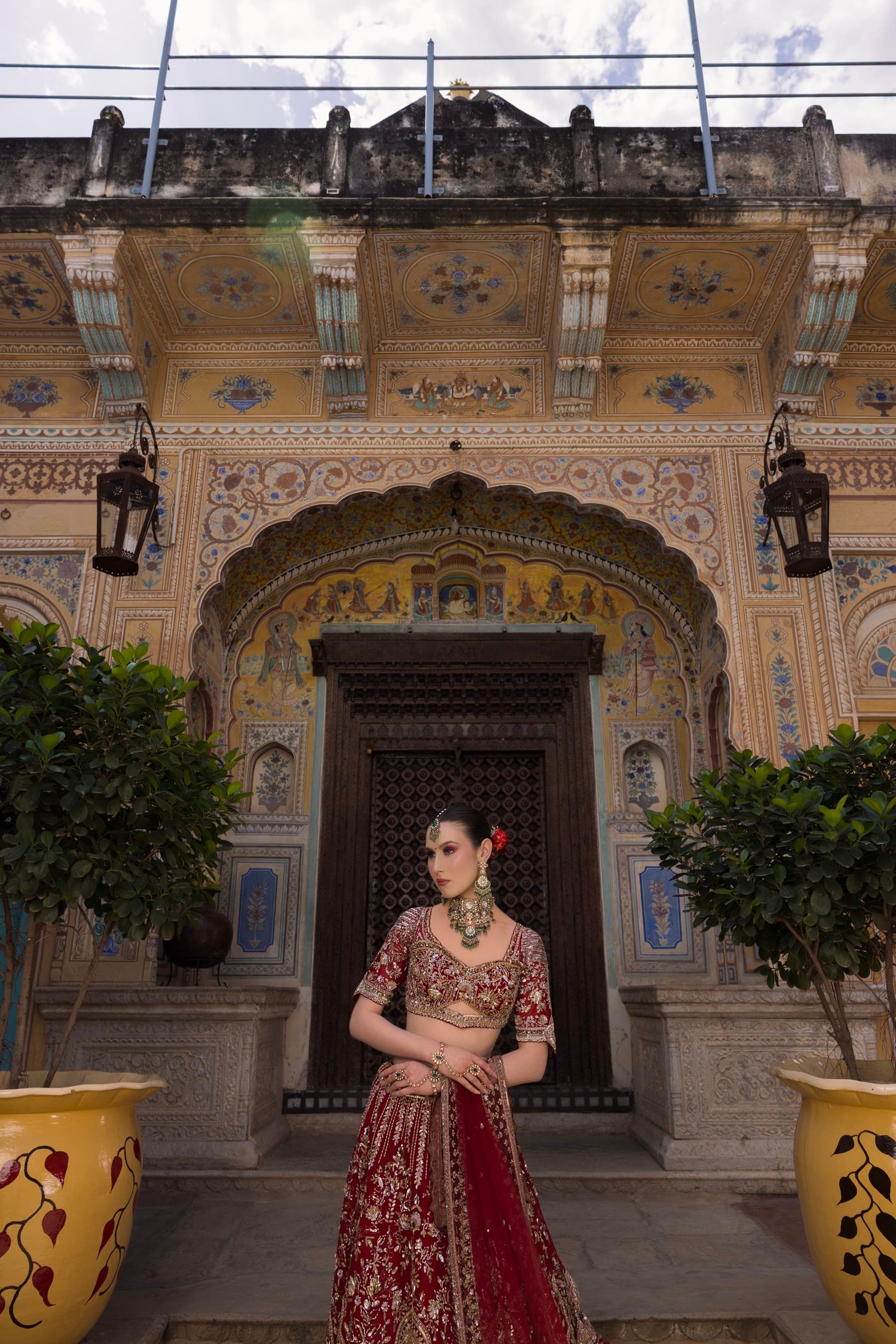 A bride framed in the carved doorway