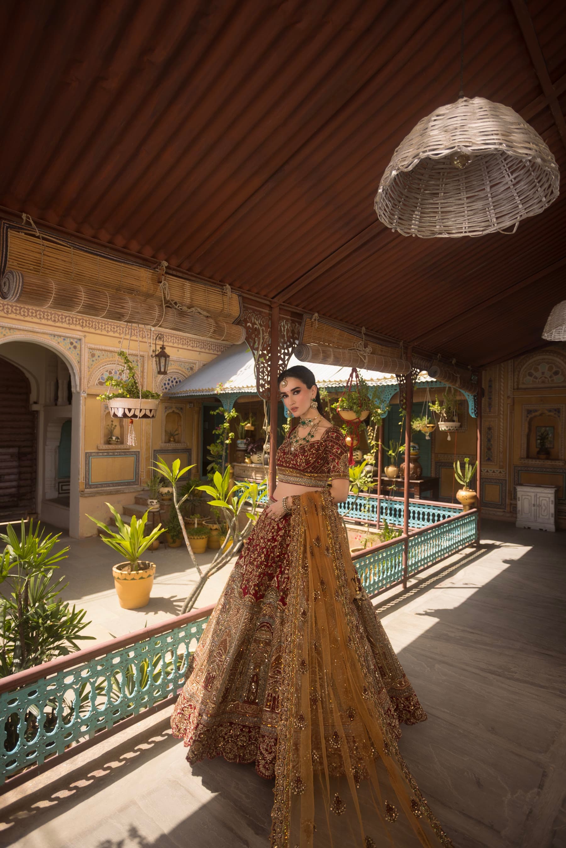 The length of the veranda, lantern above, the bride at the far end